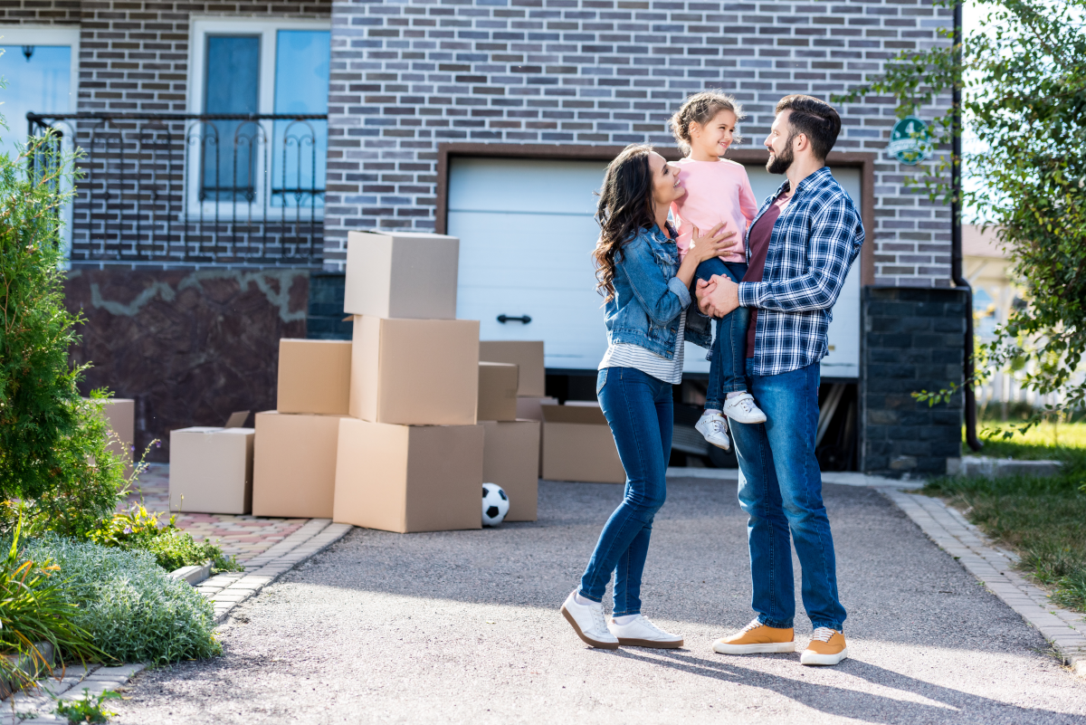 family moving in to their new home by using mortgage points to lower their interest rate.