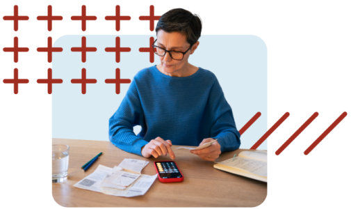 Woman using a calculator to calculate her financial goals