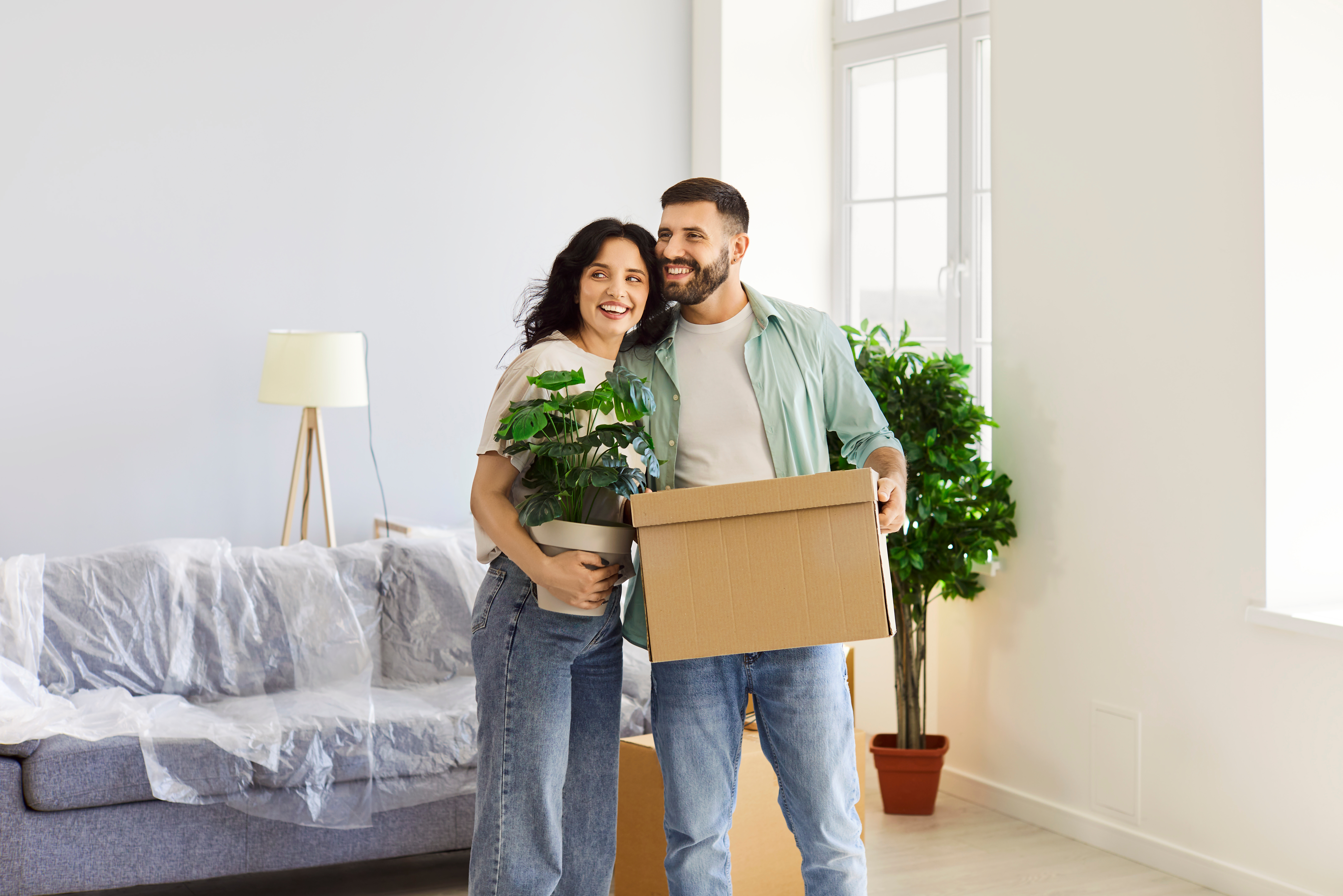 Couple moving into their new home using a Masshousing Loan