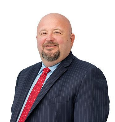 Leader Bank's Falmouth Branch Manager, Brendan Pike, smiling wearing a red tie.