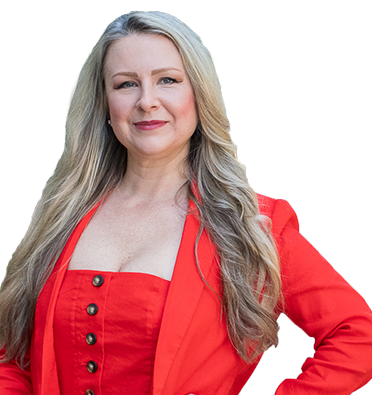 Chantelle Duquenoy Garrett smiles in a red blazer and dress.