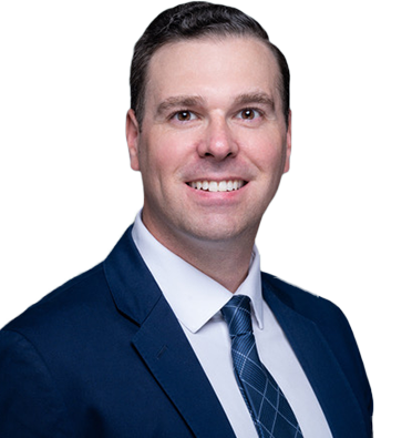 Leader Bank Loan Officer Dan Kelly wearing a suit while smiling at the camera.