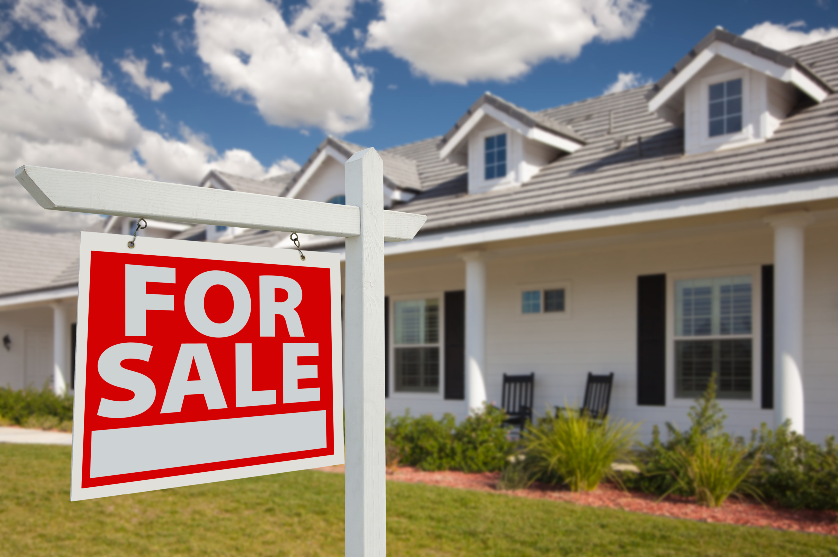 For Sale sign in front of a house - can you sell your home with a heloc?