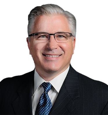 Leader Bank Loan Officer Thom Croy smiling at the camera while wearing a suit.