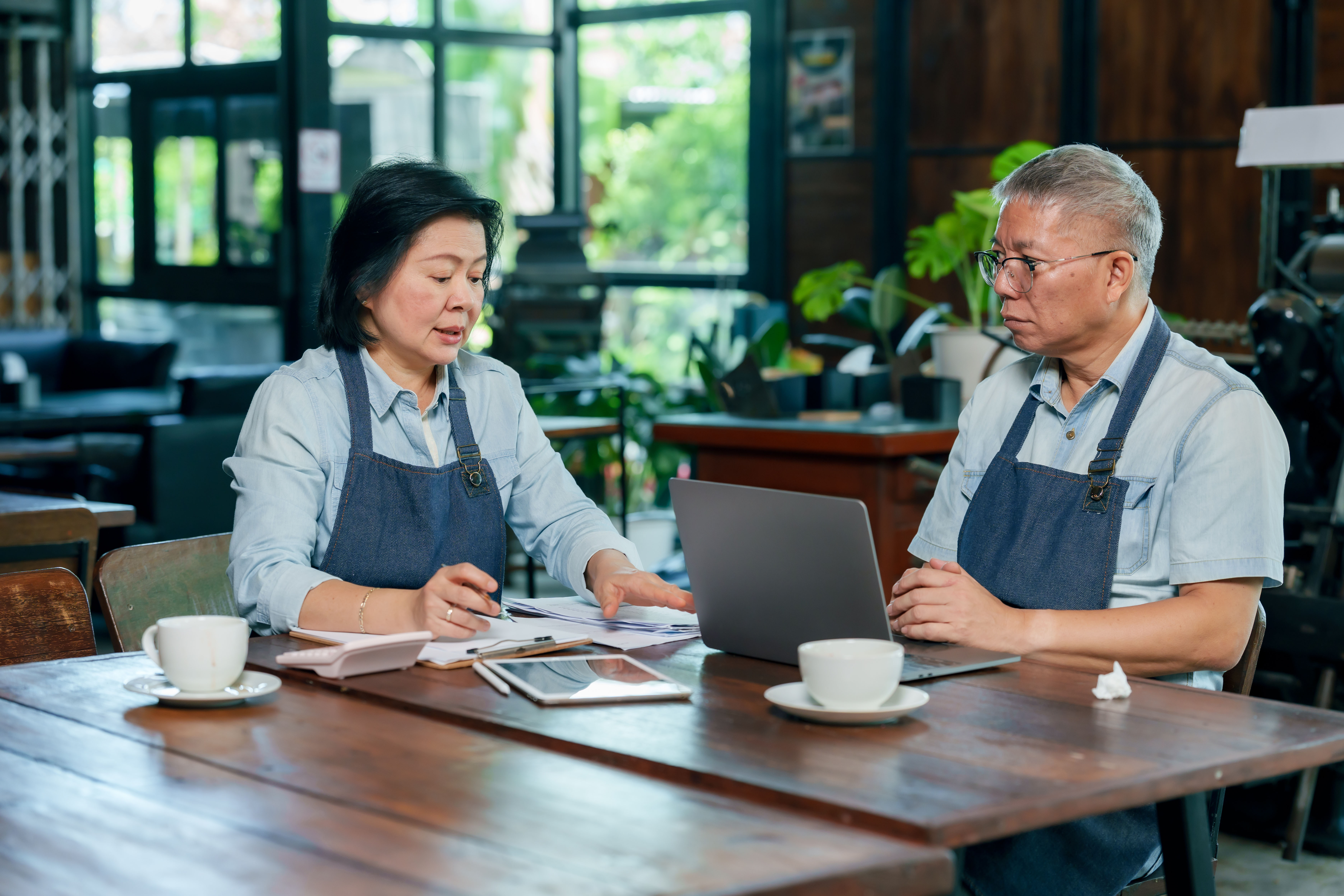 Business owners discussing account options for employees