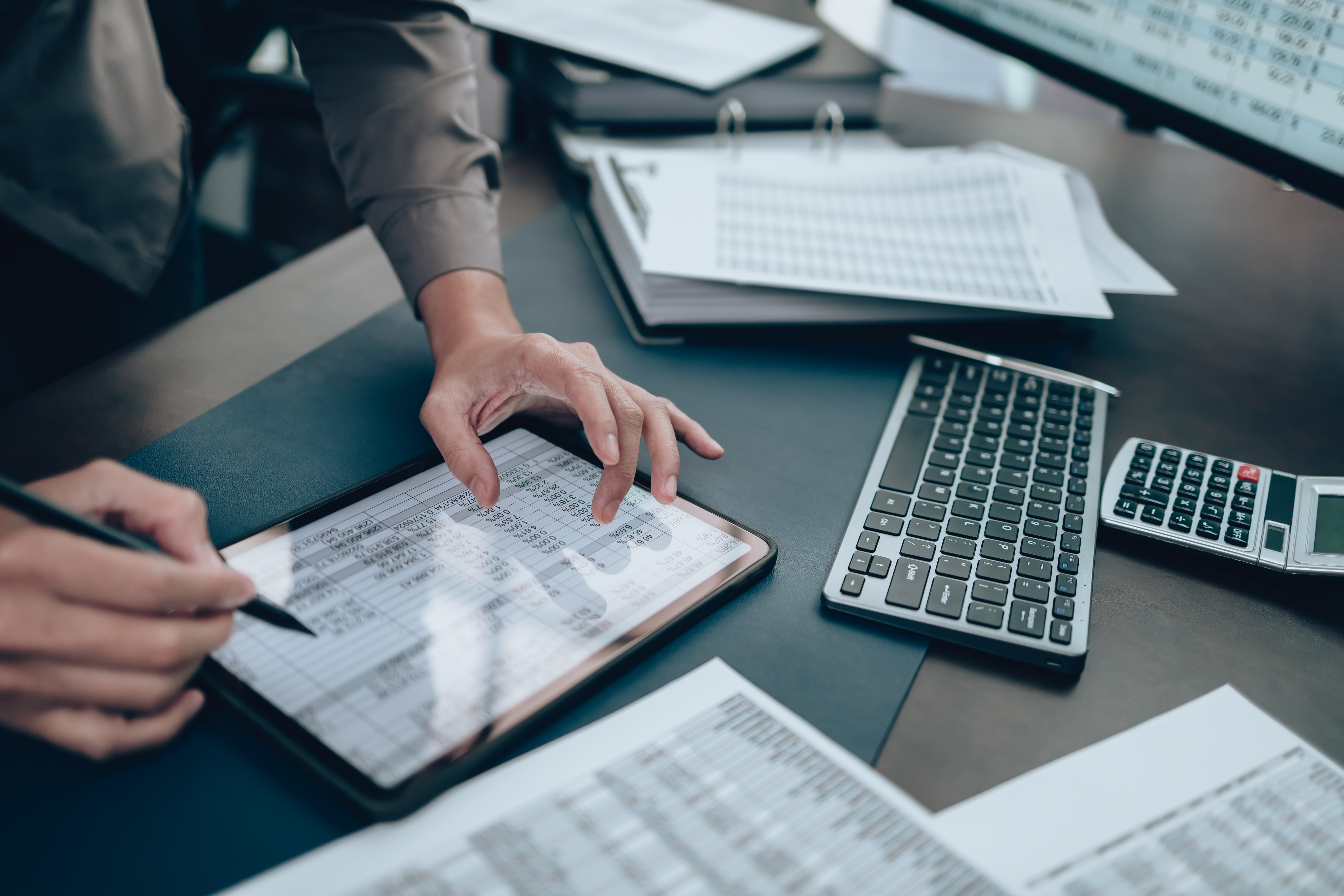 A small business owner analyzing their accounts and deciding between separate checking and savings accounts