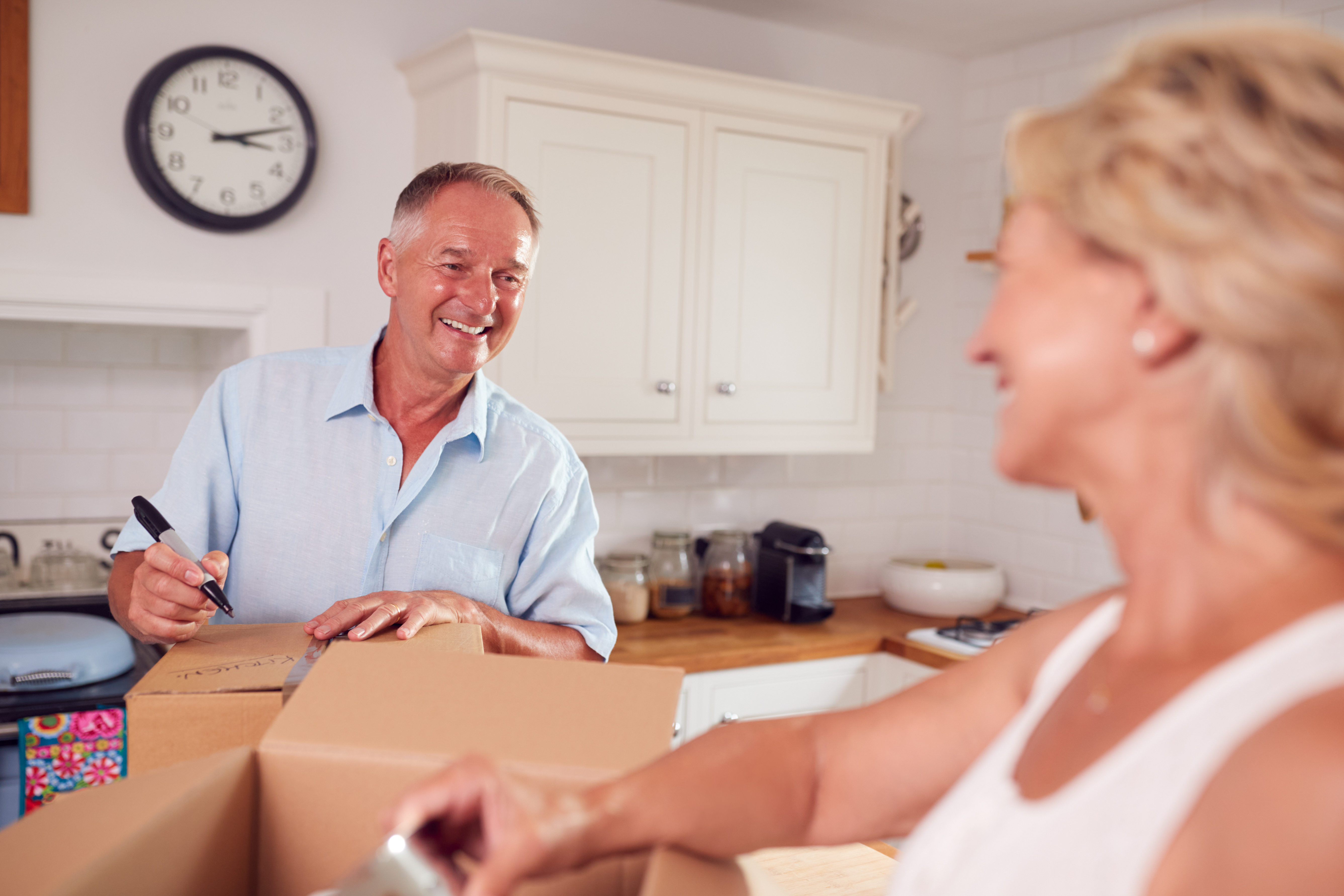 Couple discussing if they should renovate their home with a heloc or downsize