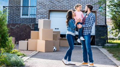 family moving in to their new home by using mortgage points to lower their interest rate.