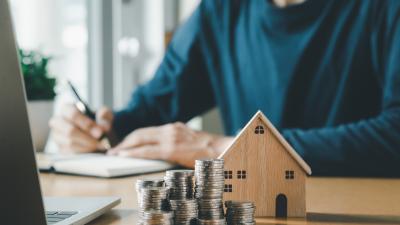 man calculating his potential mortgage interest rate