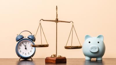 Scale between piggy bank and clock: representing the choice between CD Ladders and High Yield Savings