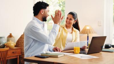 A couple celebrating that they just paid of their mortgage by using a heloc