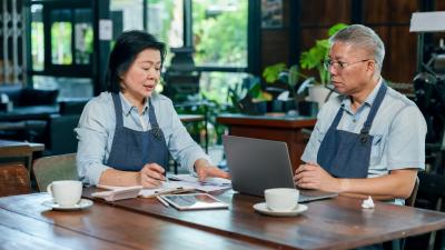 Business owners discussing account options for employees