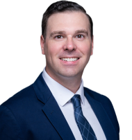 Leader Bank Loan Officer Dan Kelly wearing a suit while smiling at the camera.